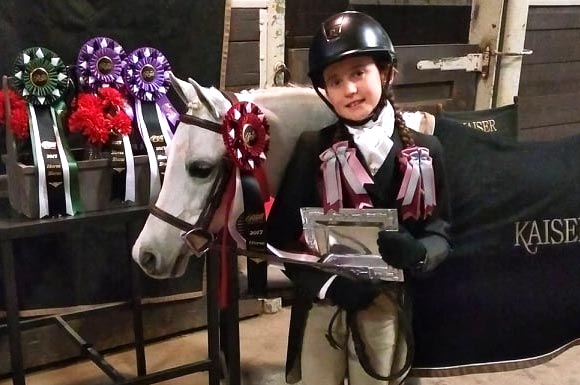 Kailey Kaiser and Northwind Snow Angel showing off ribbons and silver platter