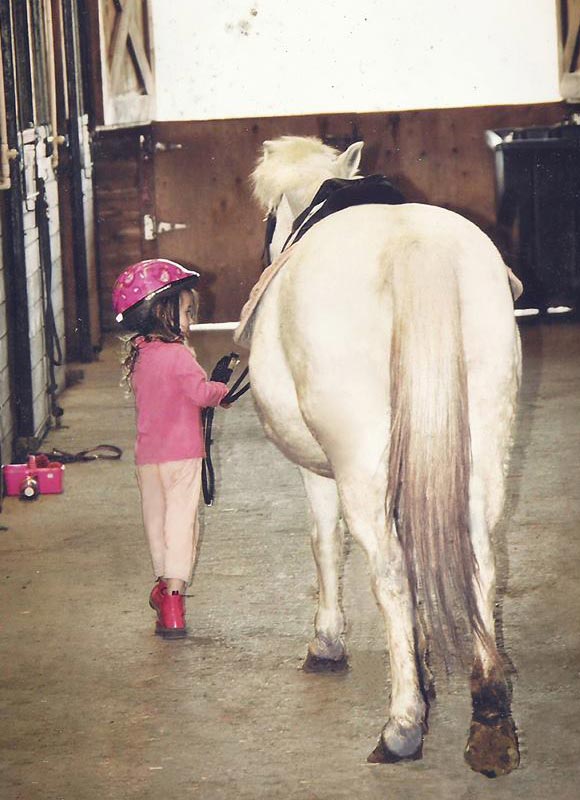 Young children horse riding lessons